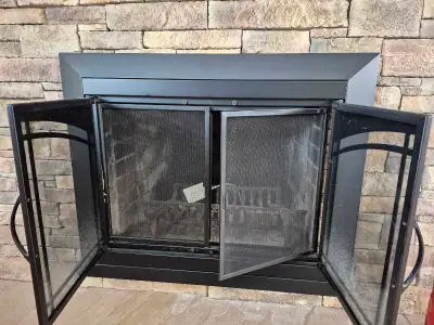 Dimensions 28w x 24 high..adjust to accommodate larger opening. Seldom used with fire. Like new.