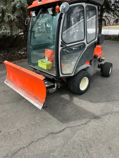 To Kabota diesel tractor with six way blade heated cab tilt steering wheel very good for driveway cl...