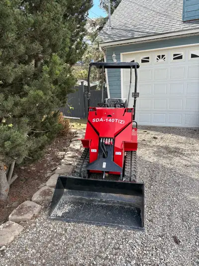 Mini skid steer with 17 hp gas engine all fluids have been changed only 3 hours on unit.