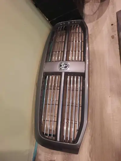 2007 ram 1500 front bumper - $100.00, pair of tail lights - $75.00, pair of headlights - $50.00, gri...