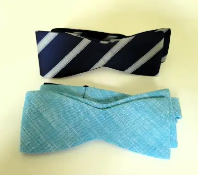 2 x brand new Penguin bowties. One is blue Linen & the other is navy striped. Pickup College & Shaw
