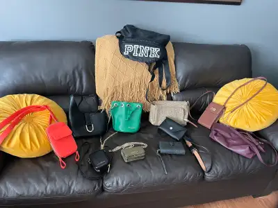 Assortment of purses, bags, wallets. Some names include Marc Jacob’s, Calvin Klein, Pink, etc…. Aski...