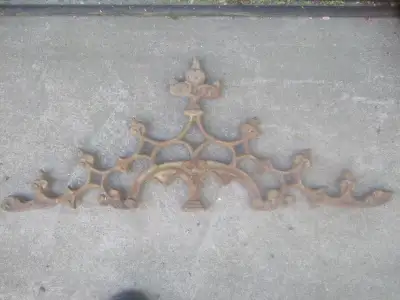 2 cast iron decorative pieces, View more