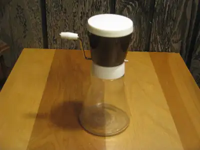 A vintage 1950 Androck Dominion Glass Canada Nut Chopper, preuse, View more