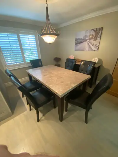 Marble top dining table, chairs and matching buffet table., View more