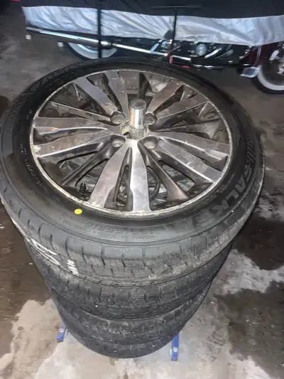 Four hardly used Falken all weather tires. Rims from Honda Fit. 185/55 R16. Purchased under a year a...