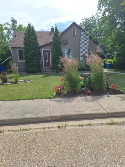 Charming well maintained and cared for bungalow with basement, tiered decking, appealing landscaping...