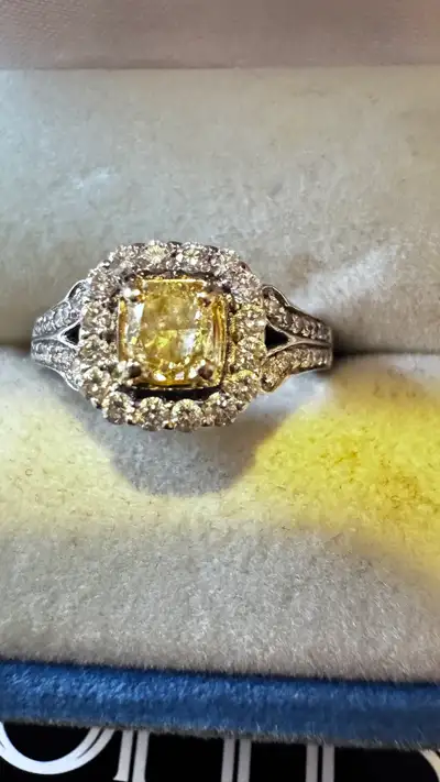 18 k White Gold EngagementRing w/one 0.70 Natural Yellow Diamond, View more