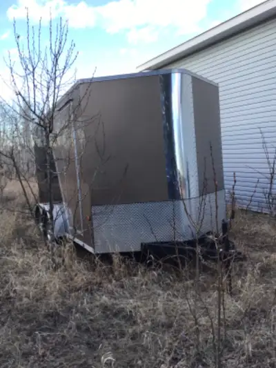 Royal trailer,extras include paint brown /black and floor liner for skidoo. Measures 14 feet by 7 fe...