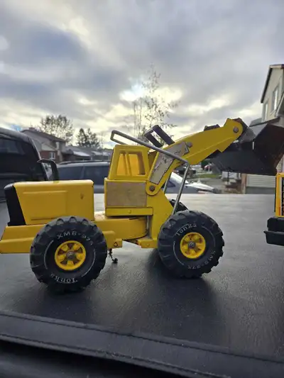 Tonka loader and cement mixer good condition all operational.