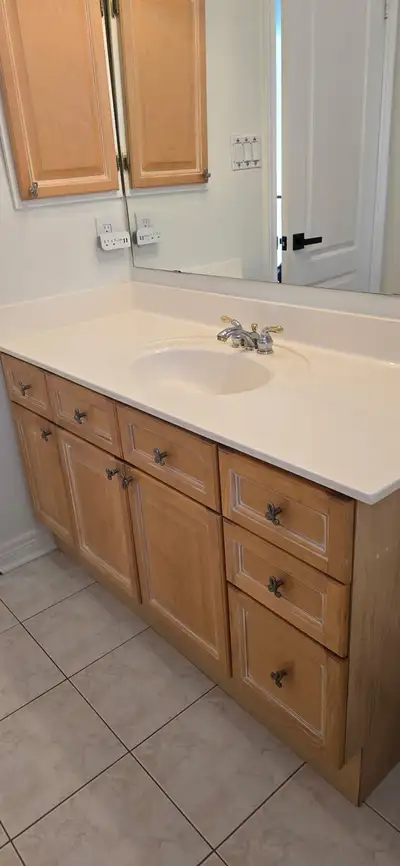 Vanity with matching medicine cabinet. Solid maple fronts. Includes taps, draws and pulls. Cabinet i...