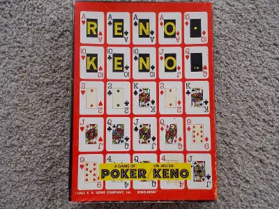 The game pieces are still unpunched from their original cardboard sheet. This E. S. Lowe Reno-Keno g...