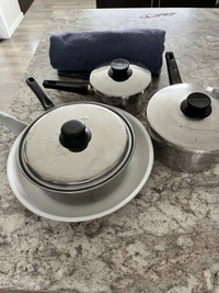 3 pots with lids and a frying pan 