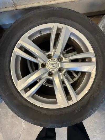 I am selling a set of four used Acura SUV rims with Continental tires, featuring a size of 235/60R18...