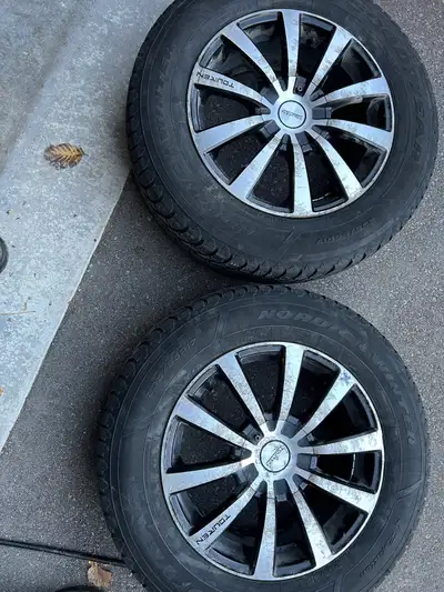 A pair of Goodyear winter tires on alloy rim, 235/65R17,multi blot pattern , including 5x120mm that...