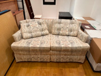 Very good condition love seat with machine-washable covers