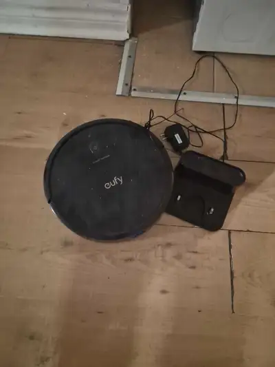 This Eufy RoboVac is a pre-owned robotic vacuum that comes complete with its original charging base...