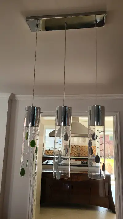 Beautiful 3-light chandelier with colored glass pendants. Removed for redesign
