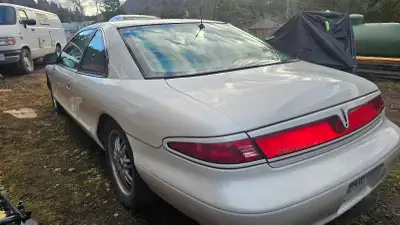 This Lincoln Mark 8 LSC is a stylish, coupe with smooth air ride suspension. It features a unique de...