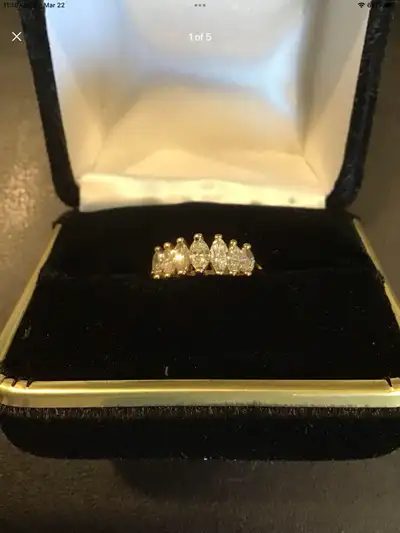 Beautiful Ladies 14k yellow gold diamond ring. Size 7-7.5 Three marquise cut diamonds, Carat weight...