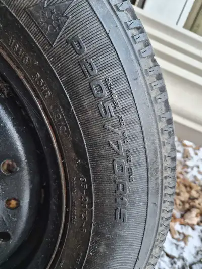 I'm selling a set of four Goodyear snow tires, size P205/70R15, mounted on rims, originally from a 2...