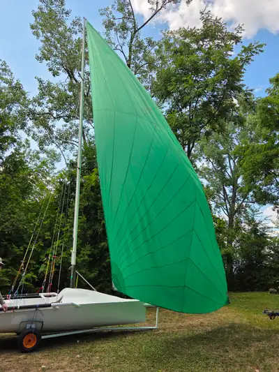 International 14 with main, jib and spinnaker in fair condition for its age. Many new lines. Trailer...