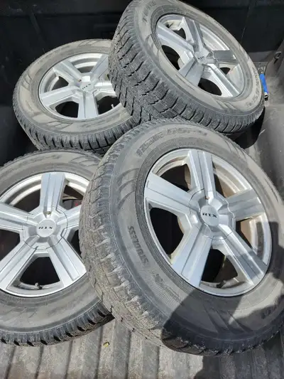 4 rims with good winter tires. These came off of a 2018 GMC Sierra 1500. RTX rims with Toyo Tires. T...