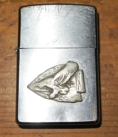 $40 Zippo lighter made in Canada, year 2000, Eagle design on front. Has wick and flint, add fluid if...