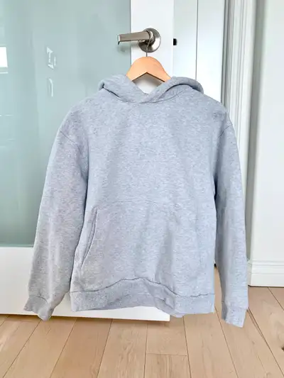 Fits closer to a size medium. No stains, no rips, no holes. Kept in my smoke-free and pet-free home....