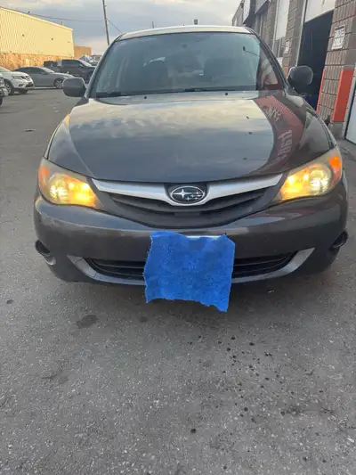 This is a 2011 Subaru Impreza, a reliable and stylish sedan. This car has been well-maintained and i...