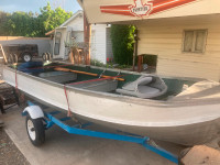 Boat and trailer with electric motor