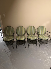 A set of 4 wrought iron chairs 