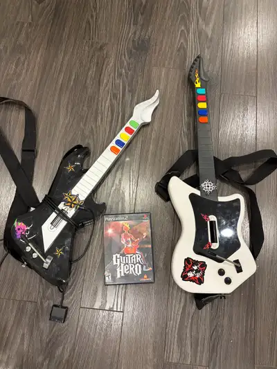 Guitar HeroFor PS2 Game + 1 wireless guitar + 1 wired guitar Good used condition $20