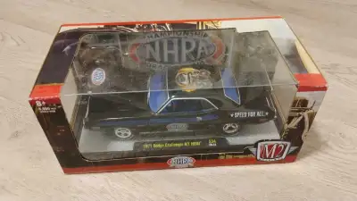 This M2 Machines 1971 Dodge Challenger R/T HEMI is a highly detailed die-cast collectible car, perfe...
