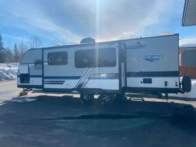 This unit is a 2017 Jayco Whitehawk 27 RB (rear bathroom). It has 27 ft of interior living space. Fe...