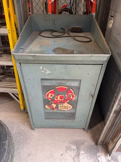 Antique cabinet that would’ve housed replacement tubes for radios and TVs . Testing equipment would...