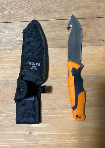 Brand new condition. Fixed-blade knife with sharp gut hook, ergonomic orange/black handle, and durab...