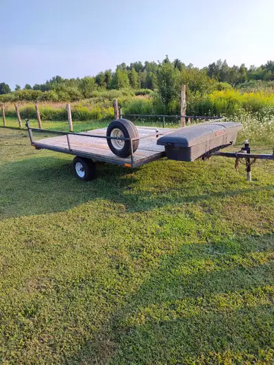 This is a used utility snowmobile trailer perfect for hauling your sleds or other gear. It features...