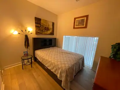 A private, spacious bedroom with own full bathroom in a two-bedroom condominium unit to share with a...