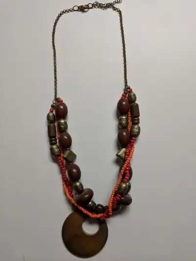 Chunky wooden red and orange bead necklace. $10 One deep orange and red beaded bracelet. Elasticized...