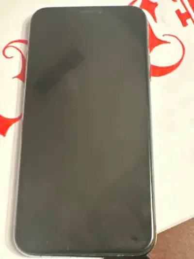 iPhone XS has a crack on the back side still works great battery at 86% comes with extra screen repl...
