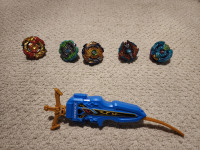6 Beyblades with launcher