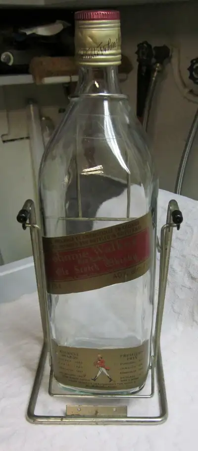Vintage Johnnie Walker tipping liquor bottle on swing, View more
