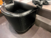 Curved black leather chair