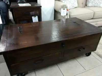This is a used coffee table with a matching end table, perfect for adding a rustic touch to your liv...