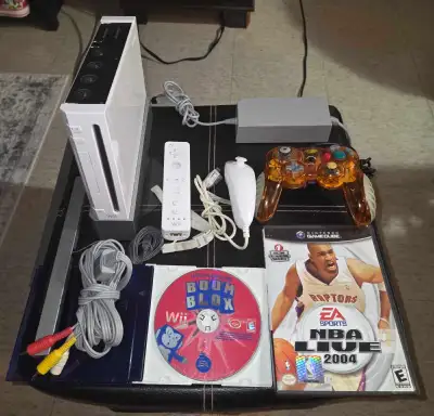 - Wii system - Wii base stand - Power/Av cable - Sensor bar - Nunchuck + controller - Madcatz Gamecu...