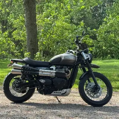 Own a piece of modern classic history with this 2022 Triumph Street Scrambler Sandstorm Edition – a...