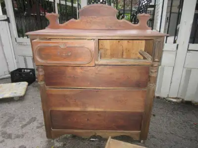 This antique bonnet chest features "2 over 3 drawers". This dresser measures 42 1/4" wide x 18 1/2"...