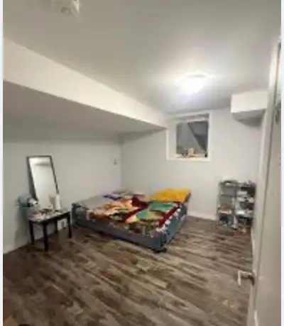 Shared basement room available for rent in a clean and quiet home. The space is shared with two othe...