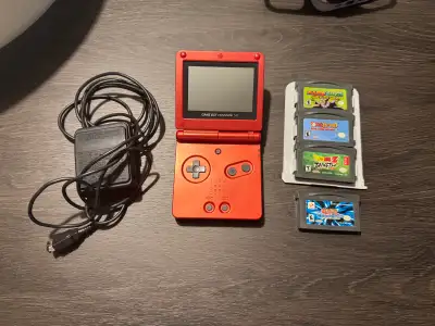 Gameboy advance SP red with 4 games and charger. Games are: - Mario and Luigi: superstar saga - Yosh...